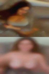 Large nude breasts along with a stomach.